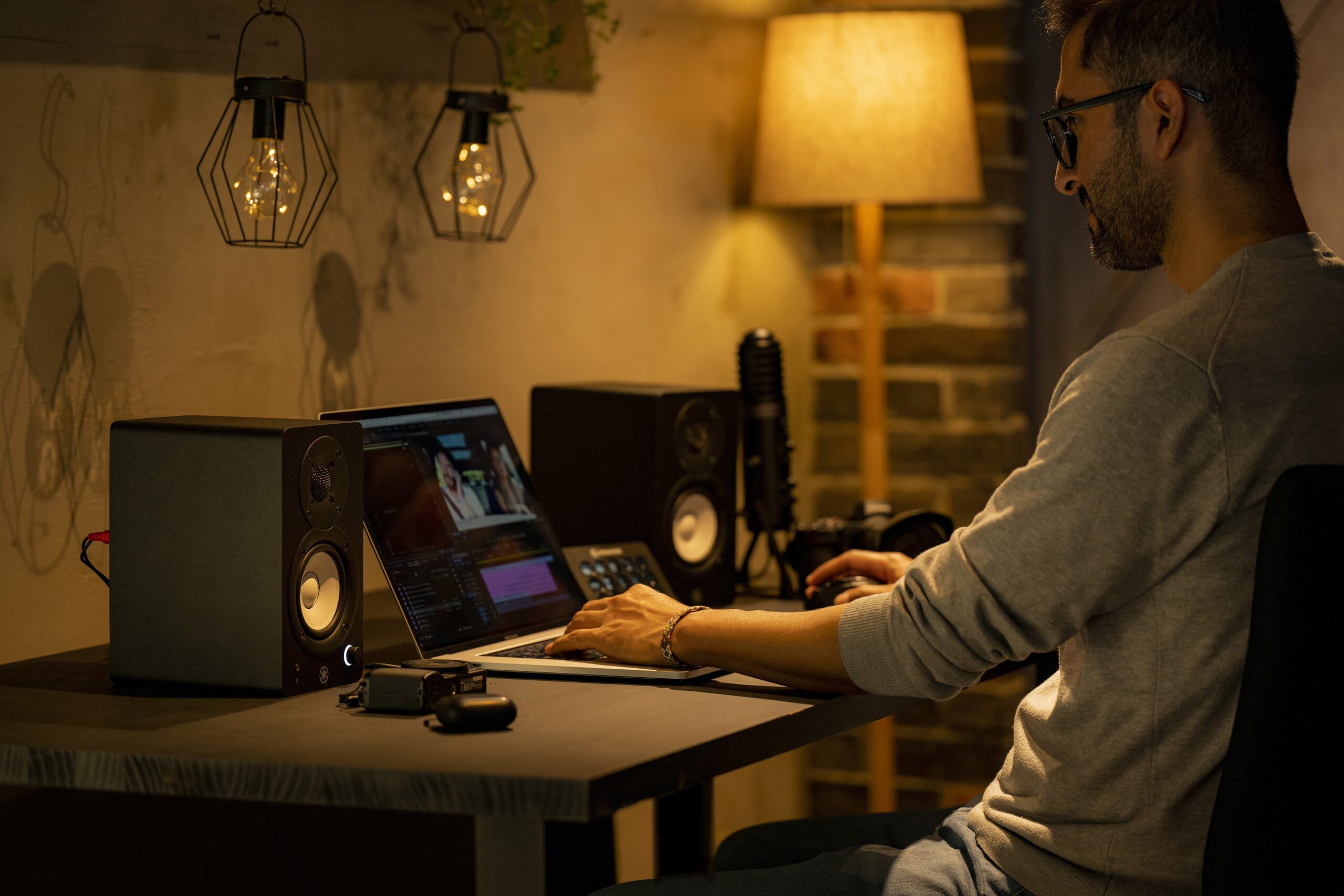 Home music studio with a condenser microphone, headphones and MIDI keyboard